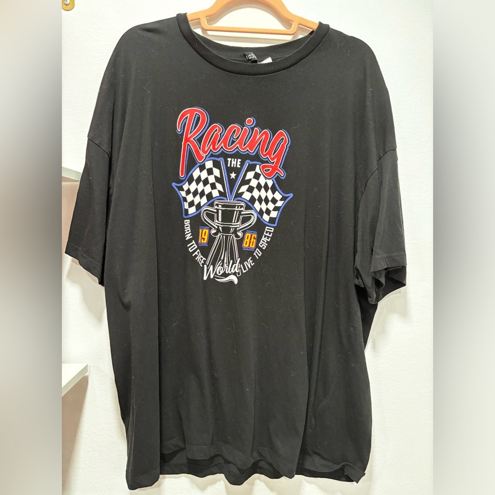 Black Divided Tshirt with racing logo and lettering on the front
